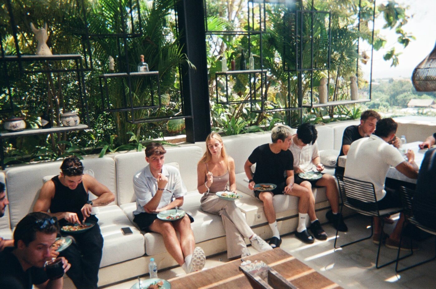 Members eating lunch together on a villa terrace